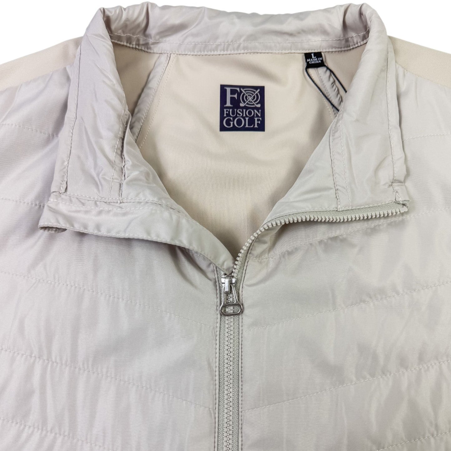 Light gray puffer vest with a brand label on a white background